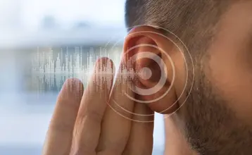 discapacidad-por-perdida-auditiva-00.jpg Primer plano de un hombre tocando su oído, acompañado de un gráfico de ondas sonoras y círculos concéntricos que simbolizan la audición, en alusión a la discapacidad por pérdida auditiva.